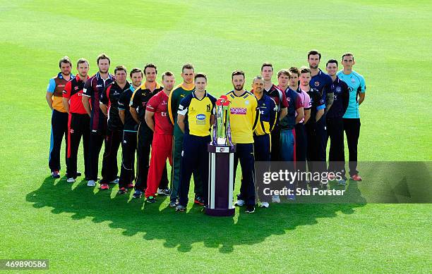 Champions Birmingham Bears player Chris Woakes and players from the other 17 counties pose with the trophy at the Natwest T20 Blast Media Launch at...