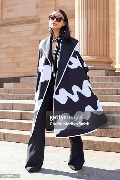 Fashion Blogger Margaret Zhang wears a Bec and Bridge coat and Pare sunglasses at Mercedes-Benz Fashion Week Australia 2015 at Carriageworks on April...