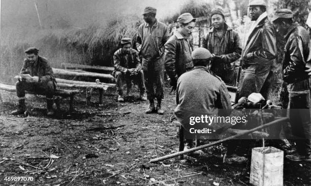 Photo depicts Cuban-Argentinian guerrilla Ernesto Che Guevara in a jungle camp of Congolese and Cuban soldiers involved in the guerilla movement in...