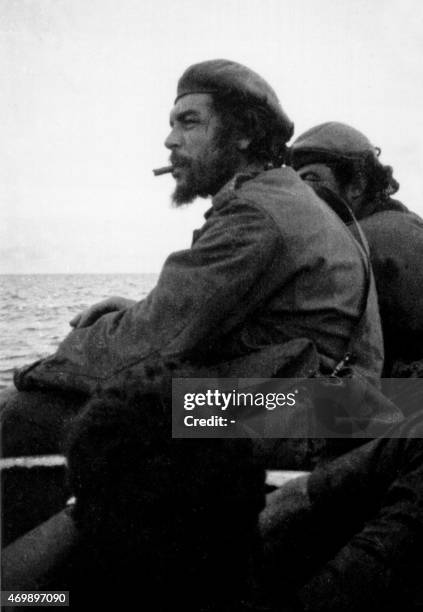 Picture taken 21 November 1965 of Argentine-born guerrilla leader Ernesto "Che" Guevara on board a barge while crossing the Tanganika Lake from the...