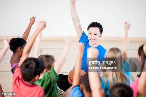 gym class with teacher - coach cheering stock pictures, royalty-free photos & images