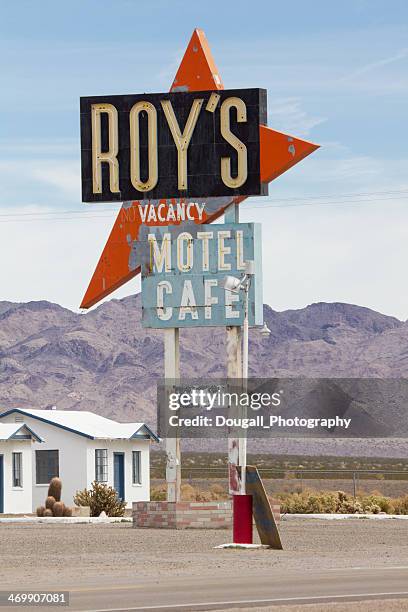 weathered roys cafe and motel neon sign on route 66 - amboy california stock pictures, royalty-free photos & images