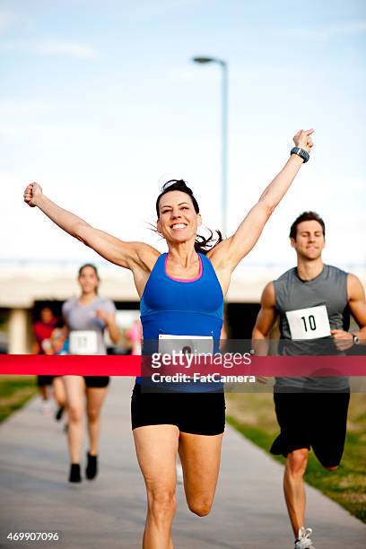 woman at finish line - happy ending bildbanksfoton och bilder
