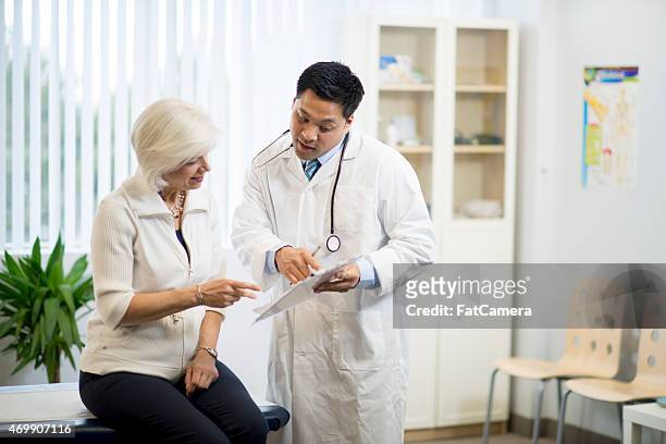 doctor with senior patient - mature woman herbs stock pictures, royalty-free photos & images