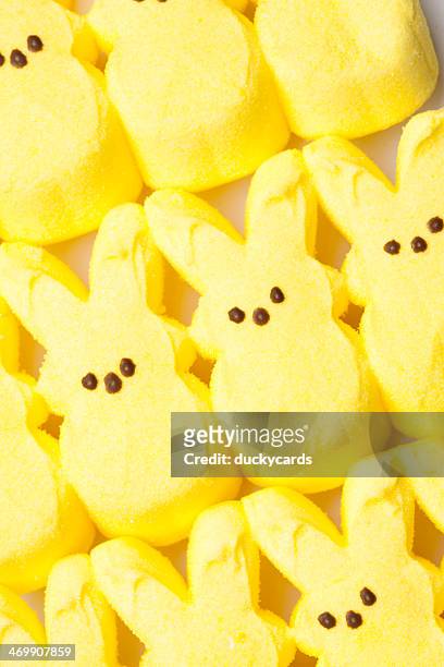 peeps yellow marshmallow easter bunnies - marshmallow peeps stock pictures, royalty-free photos & images