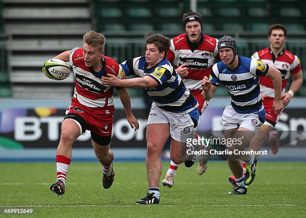 Joe Mullis of Gloucester holds off Dan Frost of Bath during the The U18 Academy Finals Day match between Bath and Gloucester at Allianz Park on...