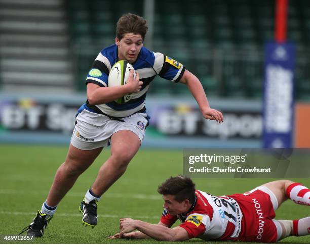 Dan Frost of Bath skips the tackle from Gloucester's Charlie Norman during the The U18 Academy Finals Day match between Bath and Gloucester at...