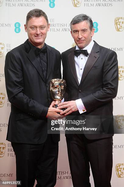 Screenwriters Jeff Pope and Steve Coogan, winners of the Adapted Screenplay award, pose in the winners room at the EE British Academy Film Awards...