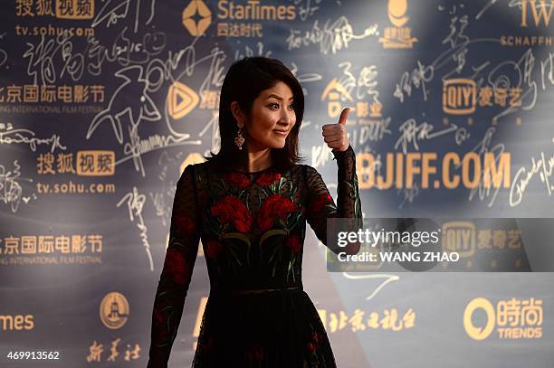 Hong Kong singer Kelly Chen arrives for the red carpet event during the opening ceremony of the fifth Beijing International Film Festival at Yanqi...