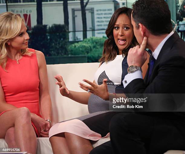 Elisabeth Hasselbeck, guest Tamera Mowry and Brian Kilmeade appear on "FOX & Friends" at FOX Studios on April 16, 2015 in New York City.