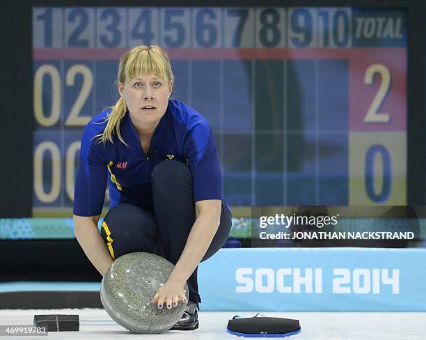 Sweden's Maria Prytz prepares a stone during the Women's Curling Round Robin Session 12 against Japan at the Ice Cube Curling Center during the Sochi...