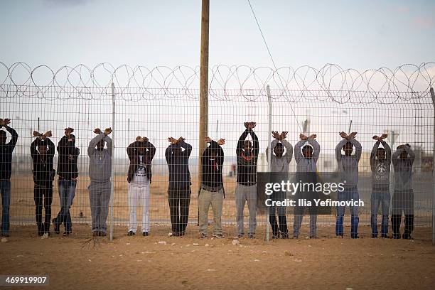 Asylum seekers who are being held take part in a day of protest at the of Holot detention center where hundreds of migrants are being held on...