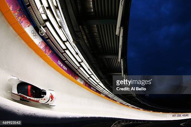 Pilot Lyndon Rush and Lascelles Brown of Canada team 1 make a run during the Men's Two-Man Bobsleigh on Day 10 of the Sochi 2014 Winter Olympics at...