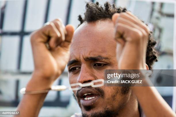 African asylum seekers, who entered Israel illegally via Egypt, stage a protest outside the Holot detention centre in Israel's southern Negev Desert,...