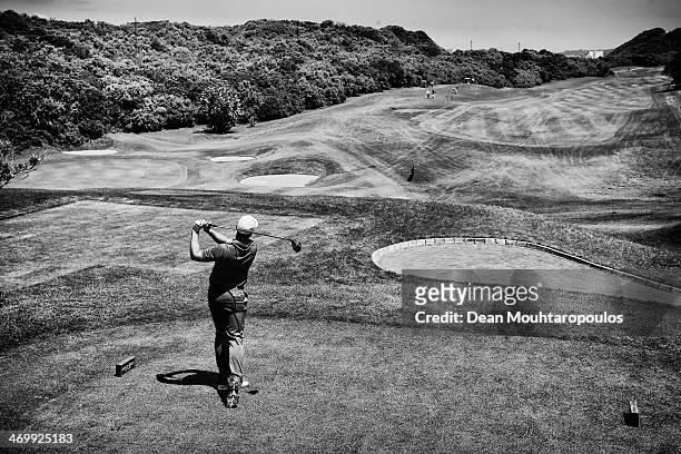 Oliver Fisher of England hits his tee shot on the 3rd hole during the Final Round of the Africa Open at East London Golf Club on February 16, 2014 in...