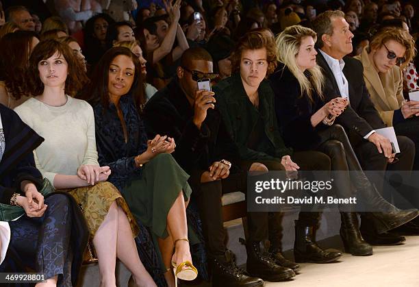 Felicity Jones, Naomie Harris, Tinie Tempah, Harry Styles, Alison Mosshart, Mario Testino and Jamie Campbell Bower attend the front row at Burberry...