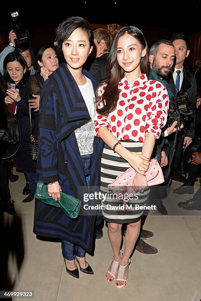 Guey Lun-Mei and Angelababy attend the front row at Burberry Womenswear Autumn/Winter 2014 at Kensington Gardens on February 17, 2014 in London,...