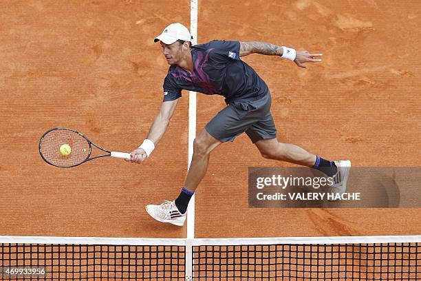 Austrian player Andreas Haider Maurer returns the ball to Serbian player Novak Djokovic during the Monte-Carlo ATP Masters Series Tournament tennis...