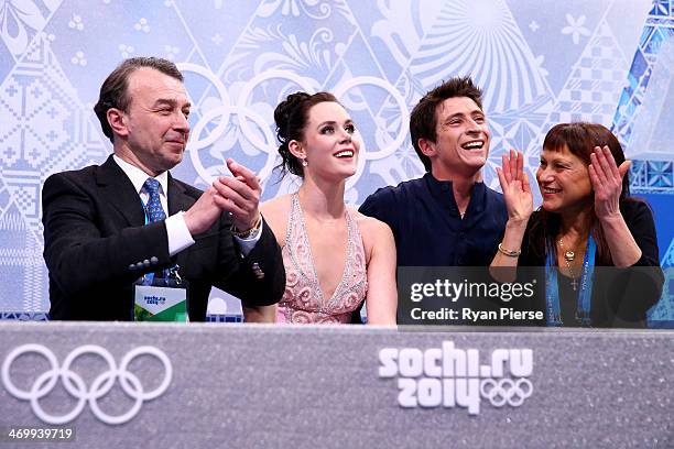 Tessa Virtue and Scott Moir of Canada wait for their score with their coaches Oleg Epstein and Marina Zoueva in the Figure Skating Ice Dance Free...