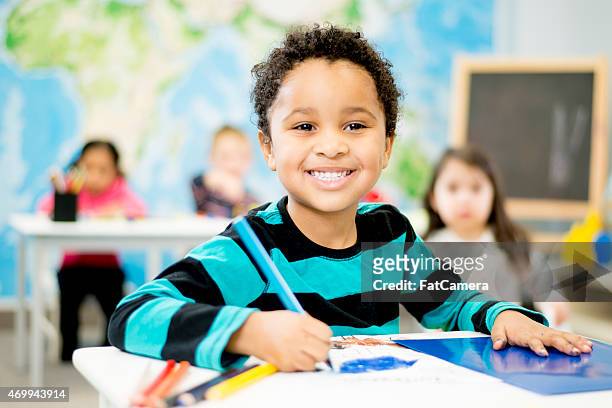 little boy in preschool - preschool art stock pictures, royalty-free photos & images