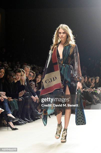 Cara Delevingne walks the runway as Naomie Harris, Tinie Tempah, Harry Styles, Alison Mosshart, Mario Testino, Jamie Campbell Bower and Angelababy...