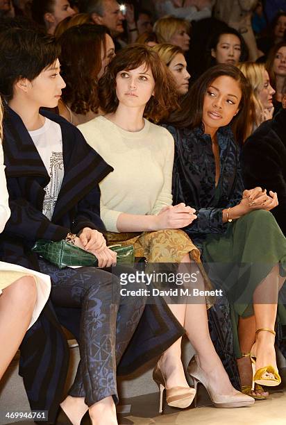 Guey Lun-Mei, Felicity Jones and Naomie Harris attend the front row at Burberry Womenswear Autumn/Winter 2014 at Kensington Gardens on February 17,...