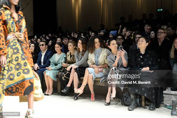Carina Lau and guests attend the front row at Burberry Womenswear Autumn/Winter 2014 at Kensington Gardens on February 17, 2014 in London, England.