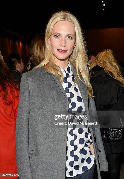 Poppy Delevingne attends the front row at Burberry Womenswear Autumn/Winter 2014 at Kensington Gardens on February 17, 2014 in London, England.
