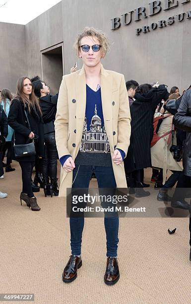 Jamie Campbell Bower attends the front row at Burberry Womenswear Autumn/Winter 2014 at Kensington Gardens on February 17, 2014 in London, England.