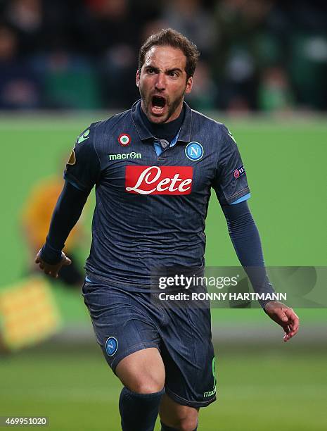 Napoli's Argentinian forward Gonzalo Higuain celebrates after scoring his team's opening goal during the UEFA Europa League first-leg quarter-final...