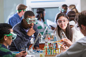 Group of multi-ethnic students in chemistry lab