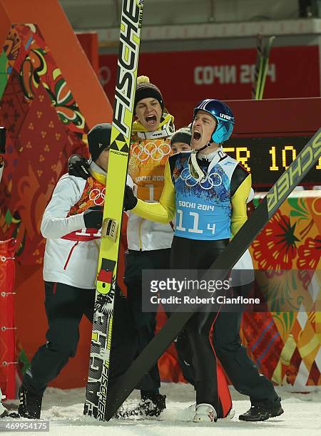 Severin Freund of Germany celebrates with his team mates Andreas Wellinger, Marinus Kraus and Andreas Wank after they won the gold medal in the Ski...