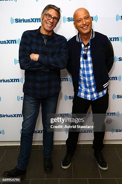 SiriusXM host Mark Goodman poses with comedian Howie Mandel at the SiriusXM Studios on April 16, 2015 in New York City.