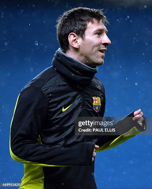 Barcelona's Argentinian forward Lionel Messi takes part in a training session at The Etihad Stadium in Manchester, north west England, on February 17...