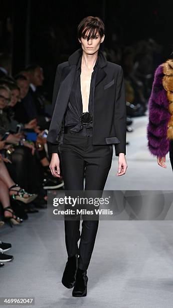 Model walks the runway at the TOM FORD show at London Fashion Week AW14 at The Lindley Hall on February 17, 2014 in London, England.