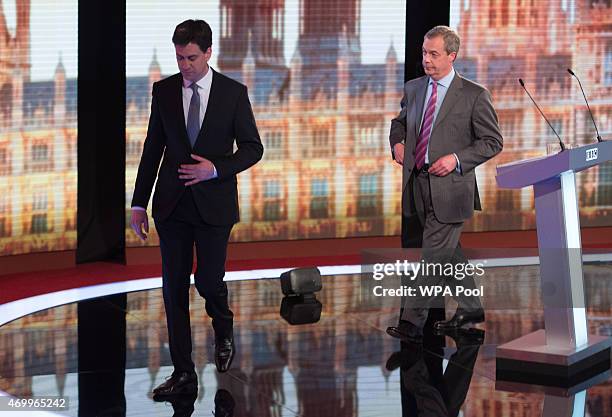 Labour leader Ed Miliband and UKIP leader Nigel Farage walk off the stage after taking part in the Live BBC Election Debate 2015 at Central Hall...