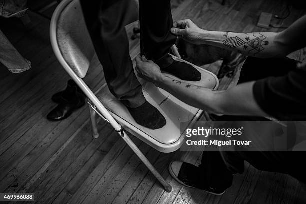 Mexican fashion designer Victor Hernal, known as Malafacha works on his new collection with a model, prior his show in Mercedes-Benz Fashion Week...
