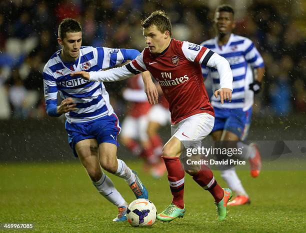 Thomas Eisfeld of Arsenal takes on Shane Griffin of Reading during the Barclays U21 Premier League match between Reading U21 and Arsenal U21 at...