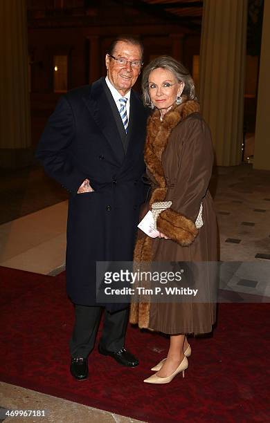 Sir Roger Moore and Kristina Tholstrup attend a Dramatic Arts Reception at Buckingham Palace on February 17, 2014 in London, England.