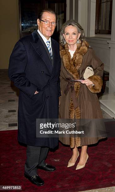 Roger Moore and Kristina Tholstrup attend a Dramatic Arts Reception at Buckingham Palace on February 17, 2014 in London, England.