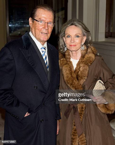Roger Moore and Kristina Tholstrup attend a Dramatic Arts Reception at Buckingham Palace on February 17, 2014 in London, England.