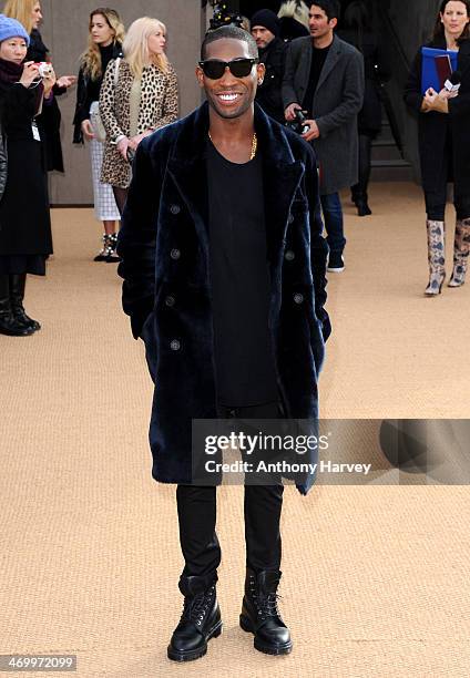 Tinie Tempah attends the Burberry Prorsum show at London Fashion Week AW14 at Kensington Gardens on February 17, 2014 in London, England.