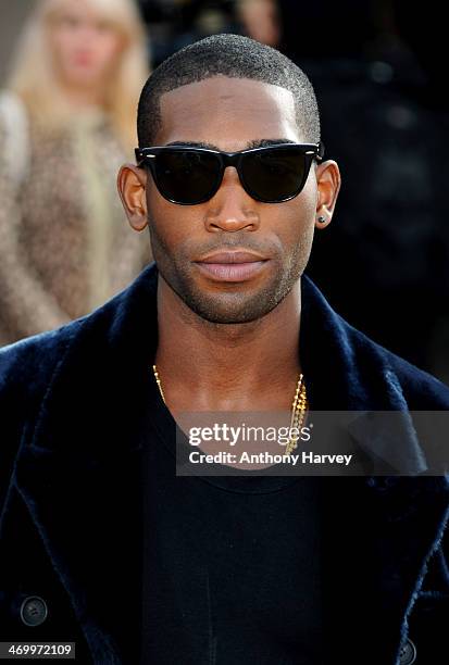 Tinie Tempah attends the Burberry Prorsum show at London Fashion Week AW14 at Kensington Gardens on February 17, 2014 in London, England.