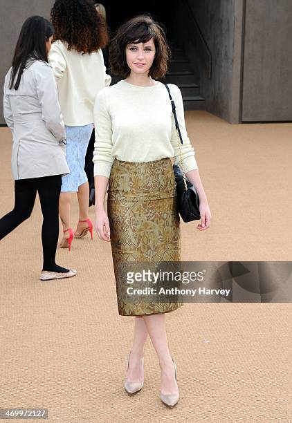 Felicity Jones attends the Burberry Prorsum show at London Fashion Week AW14 at Kensington Gardens on February 17, 2014 in London, England.