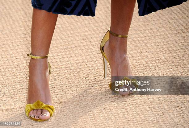Naomie Harris attends the Burberry Prorsum show at London Fashion Week AW14 at Kensington Gardens on February 17, 2014 in London, England.