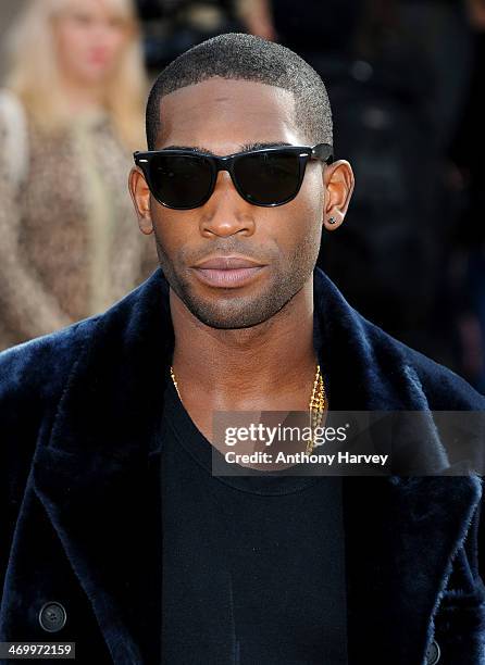 Tinie Tempah attends the Burberry Prorsum show at London Fashion Week AW14 at Kensington Gardens on February 17, 2014 in London, England.