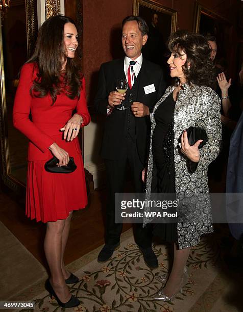 Catherine, Duchess of Cambridge meets Richard E Grant and Joan Collins during the Dramatic Arts reception at Buckingham Palace on February 17, 2014...