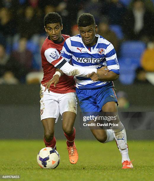 Gedion Zelalem of Arsenal wrestles with Aaron Tshibola of Reading during the Barclays U21 Premier League match between Reading U21 and Arsenal U21 at...