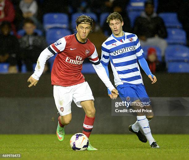 Kris Olsson of Arsenal takes on Jack Stacey of Reading during the Barclays U21 Premier League match between Reading U21 and Arsenal U21 at Madejski...