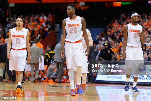 Tyler Ennis, Rakeem Christmas and C.J. Fair of the Syracuse Orange walk on the court following a time out in the second half against the North...
